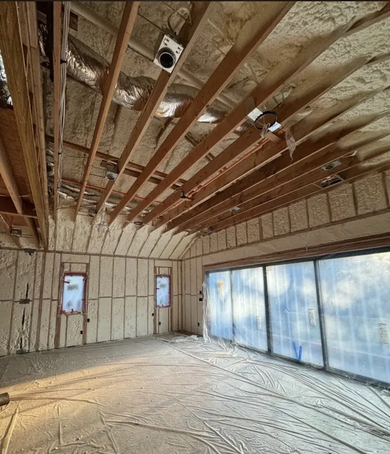 Interior walls and ceiling insulated with spray foam during new construction in Braidwood